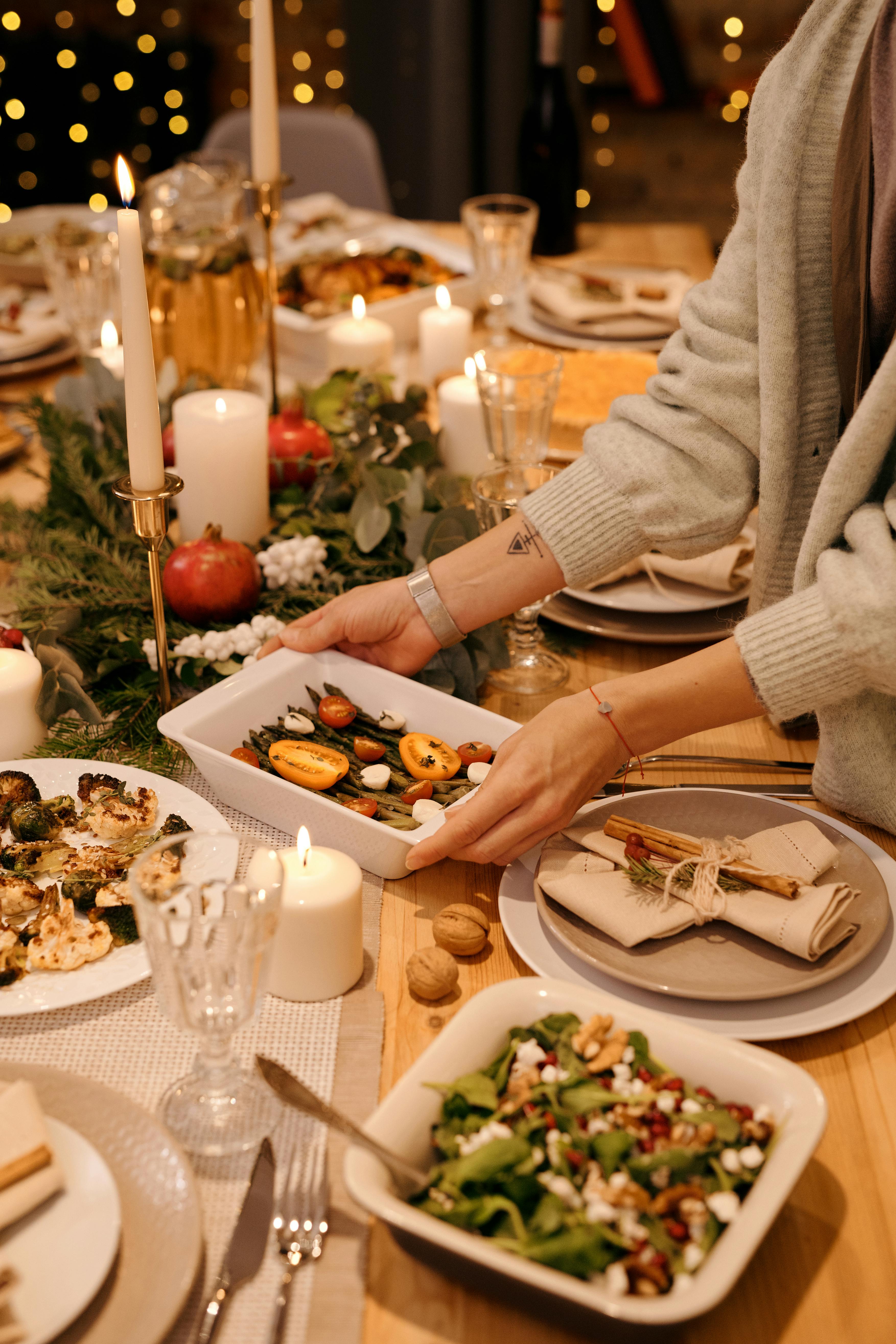 Sarah serving dinner for Mark and David | Source: Pexels