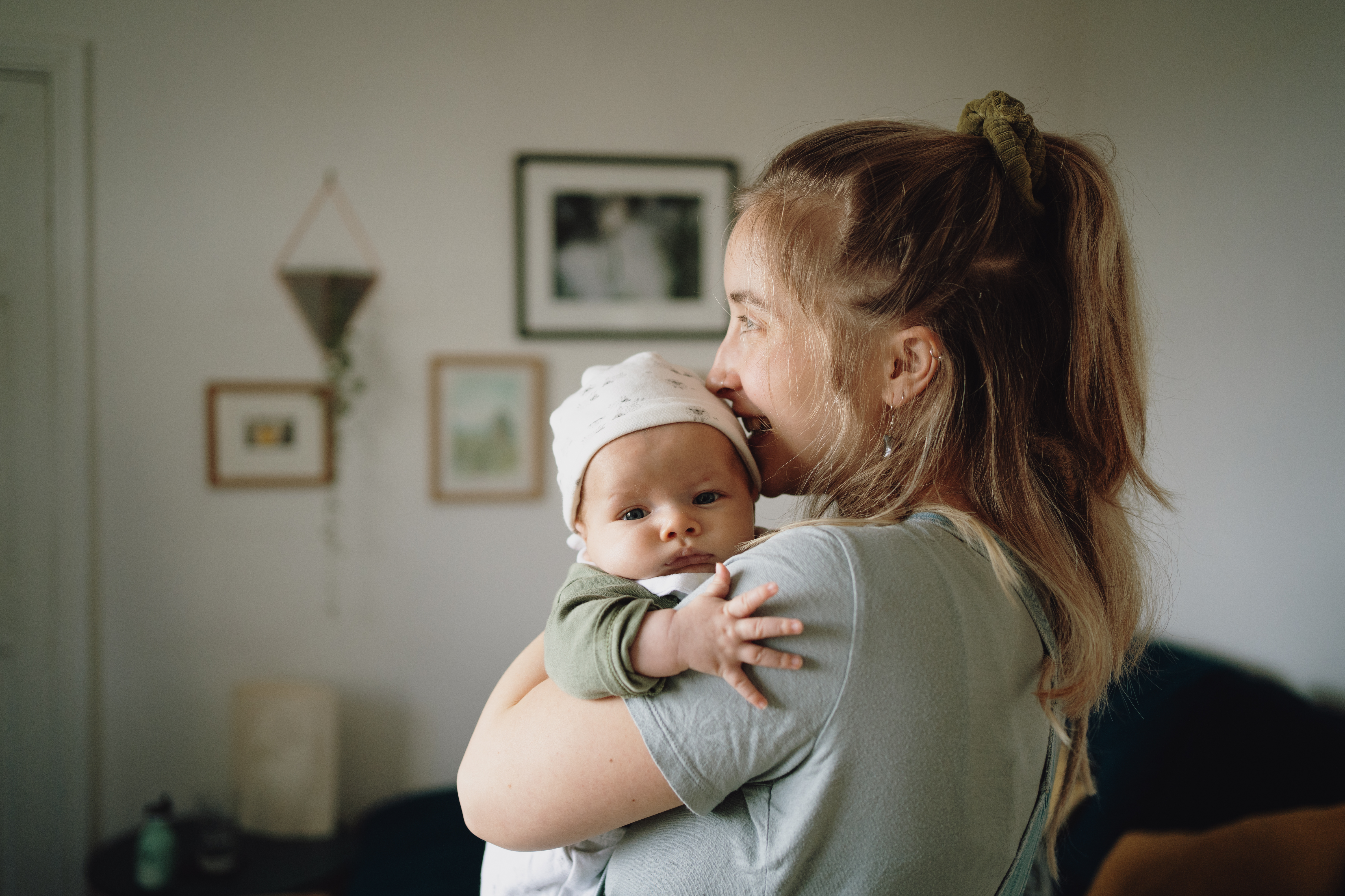 A happy woman cradling her baby | Source: Getty Images